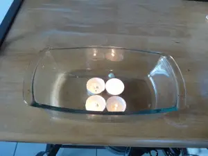 Light candles in a loaf dish. 